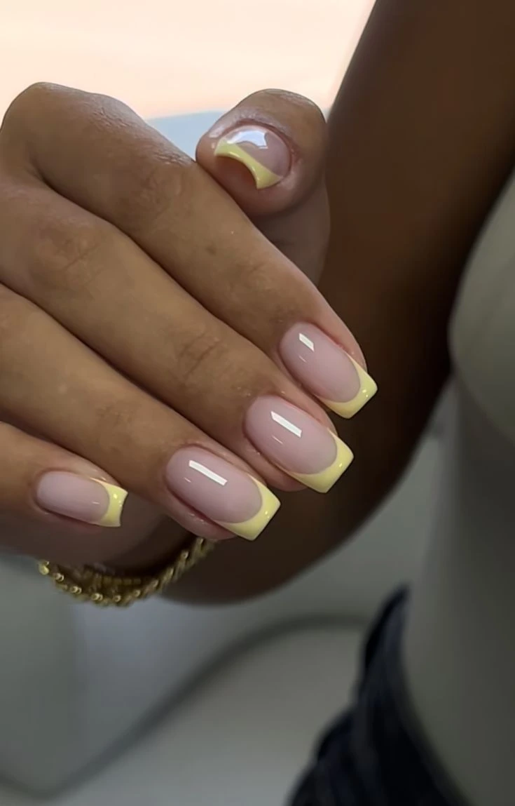 Butter yellow French tips on square acrylic nails