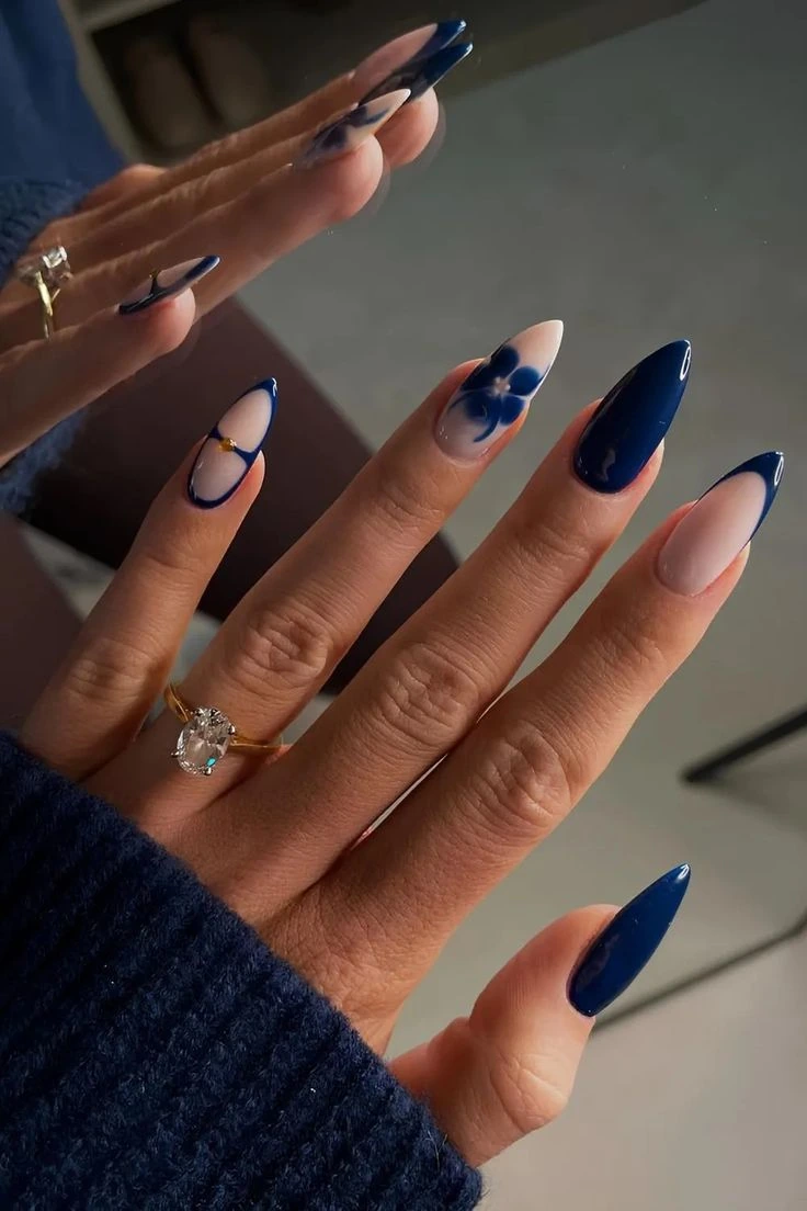 Navy blue nails with a hand painted flower accent