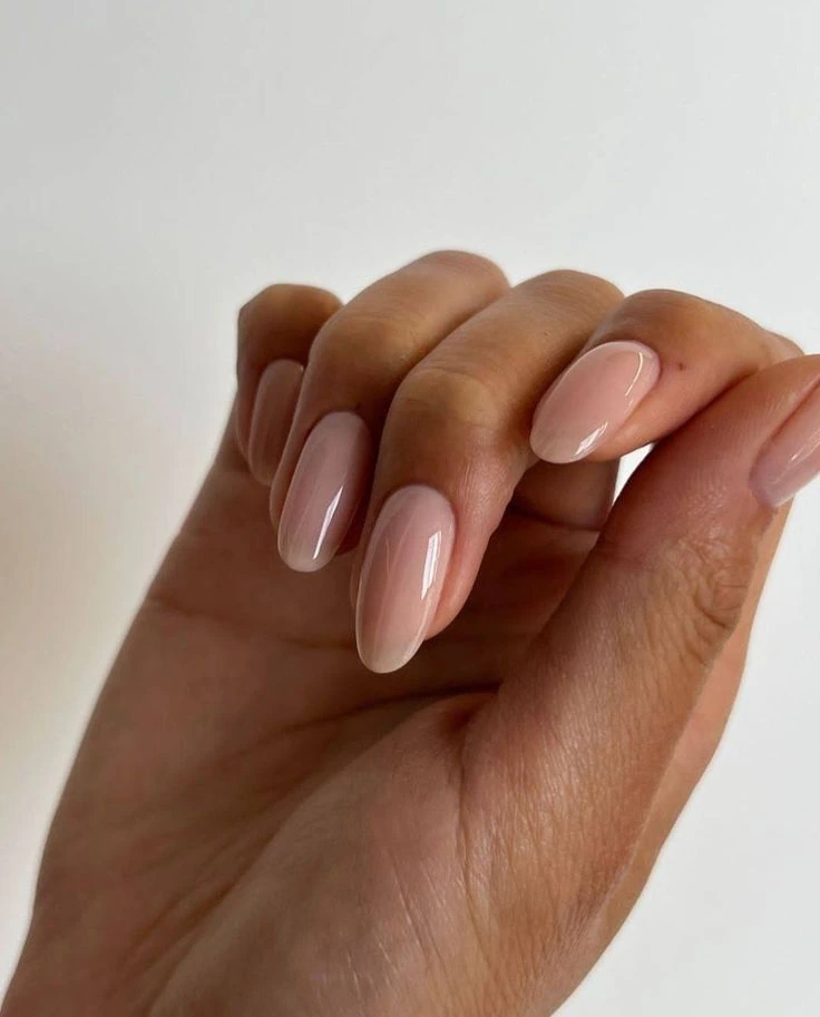 Soft nude Gel Builder nails in a natural almond shape