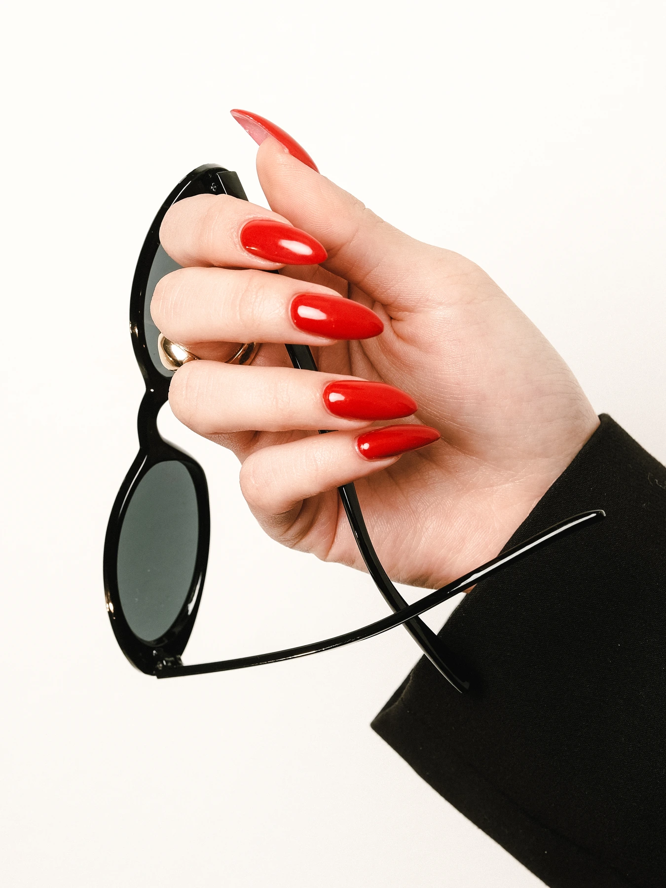 Long red almond nails with a glossy Shellak finish