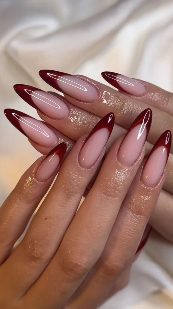 Deep burgundy red Shellak French tips on long almond nails